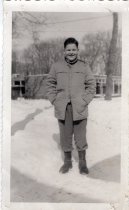An Arden Shore boy standing in the snow